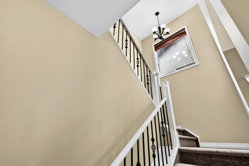 The stairs to the upper floor, 370 Silverado Way SW